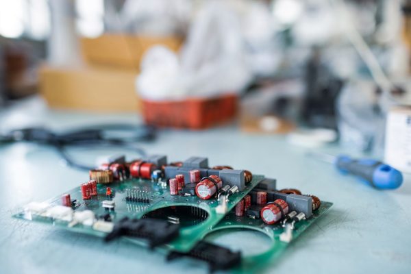 Close-up electric green embedded microcircuits in production Close-up electric green embedded microcircuits in production