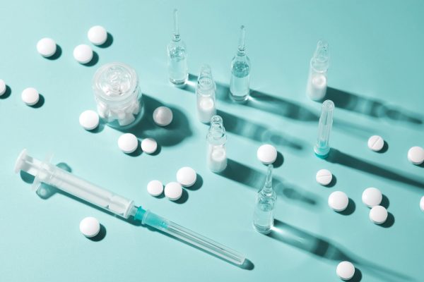 Pharmaceutical Drugs on the Blue Background Pharmaceutical Drugs on the Blue Background